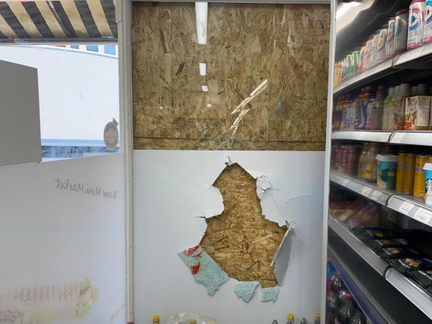 Hampshire Chronicle: Inside of River Mini Market, where the object has gone through the glass